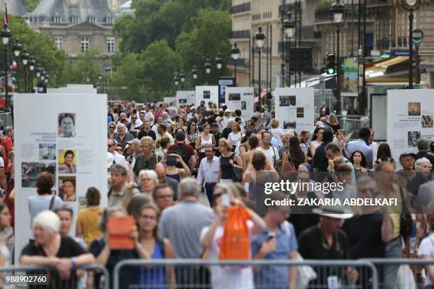 People walk on the rue Soufflot following the burial ceremony of former French politician and Holocaust survivor Simone Veil and her husband Antoine...