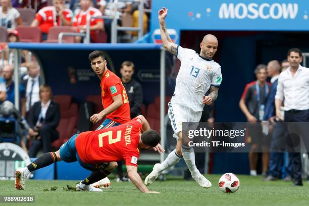 Daniel Carvajal of Spain and Fedor Kudryashov of Russia battle for the ball during the 2018 FIFA World Cup Russia match between Spain and Russia at...