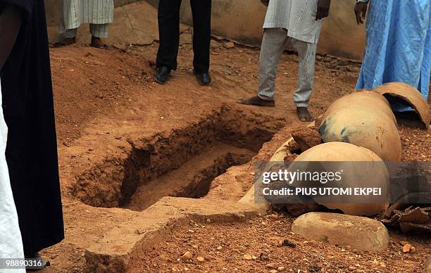 The grave of late Nigerian President Umaru Musa Yar'Adua is pictured prior to his burial at the cemetery in Katsina on, May 6, 2010. Thousands of...