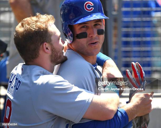 Ian Happ talks with Anthony Rizzo of the Chicago Cubs in the dugout during the Los Angeles Dodgers at Dodger Stadium on June 28, 2018 in Los Angeles,...