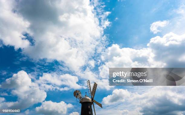 windmill in the sky - simon o stock pictures, royalty-free photos & images