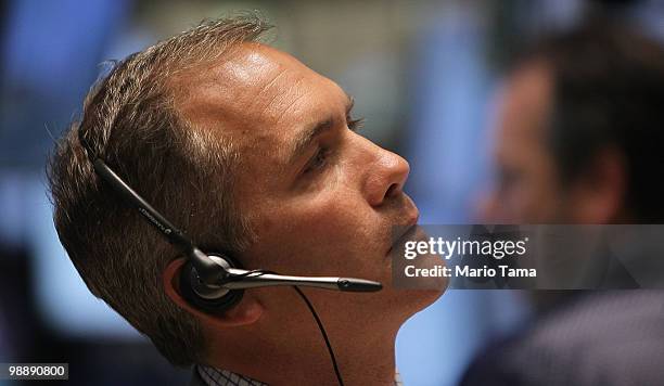 Trader works on the floor of the New York Stock Exchange before the closing bell May 6, 2010 in New York City. The Dow plunged almost 1000 points...