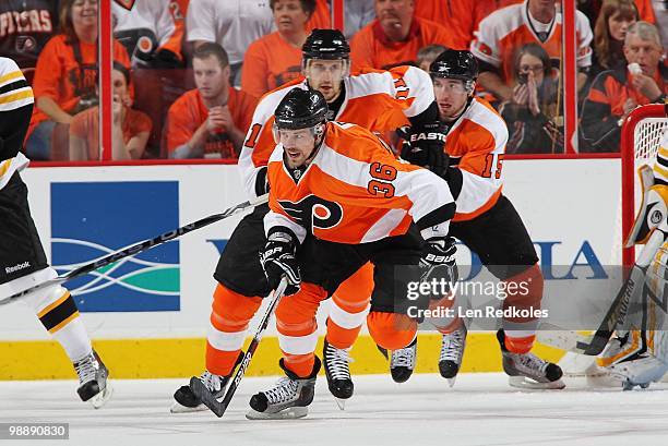 Darroll Powe, Blair Betts and Andreas Nodi of the Philadelphia Flyers skate against the Boston Bruins in Game Three of the Eastern Conference...