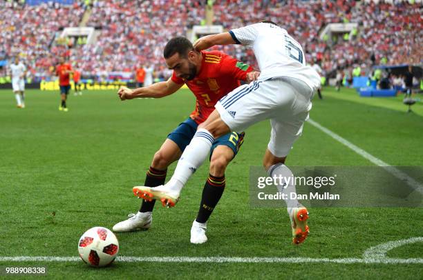 Denis Cheryshev of Russia is tackled by Dani Carvajal of Spain during the 2018 FIFA World Cup Russia Round of 16 match between Spain and Russia at...