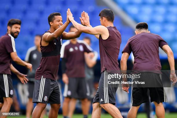 Giovani dos Santos and Hector Moreno of Mexico, celebrate during a training at Samara Arena ahead of the Round of Sixteen match against Brazil on...