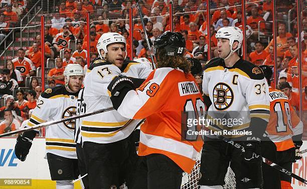 Scott Hartnell of the Philadelphia Flyers is involved in a scrum against Shawn Thornton, Milan Lucic and Zdeno Chara of the Boston Bruins in Game...