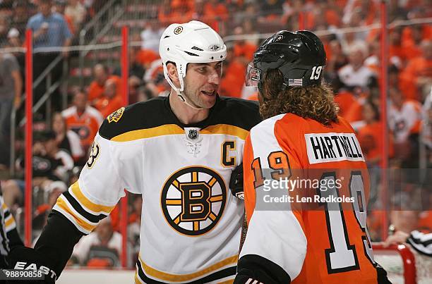 Zdeno Chara of the Boston Bruins shares some thoughts with Scott Hartnell of the Philadelphia Flyers in Game Three of the Eastern Conference...