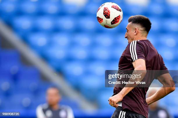 Hector Herrera of Mexico, heads the ball during a training at Samara Arena ahead of the Round of Sixteen match against Brazil on July 1, 2018 in...