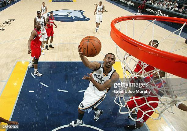 Mike Conley of the Memphis Grizzlies shoots a layup during the game against the Philadelphia 76ers at the FedExForum on April 10, 2010 in Memphis,...