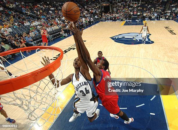 Hasheem Thabeet of the Memphis Grizzlies and Samuel Dalembert of the Philadelphia 76ers battle for a rebound during the game at the FedExForum on...