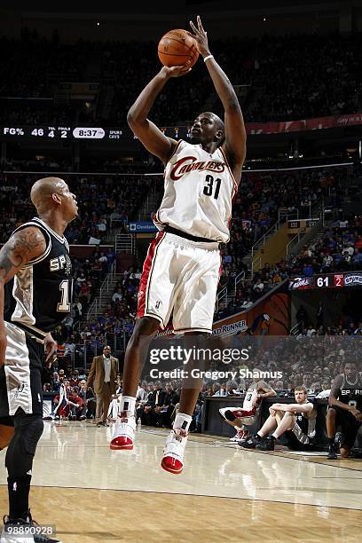 Jawad Williams of the Cleveland Cavaliers shoots a jump shot against Keith Bogans of the San Antonio Spurs during the game at Quicken Loans Arena on...