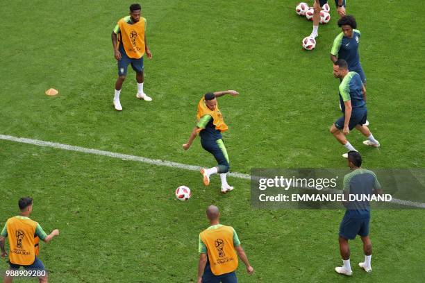 Brazil's forward Neymar and teammates take part to a training session at the Samara Arena stadium on the eve of the Russia 2018 World Cup round of 16...