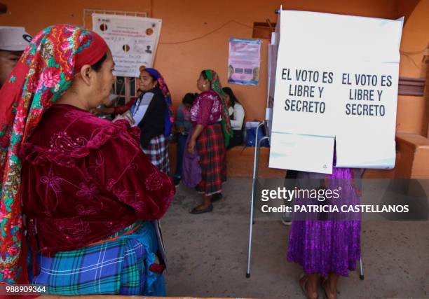 Mexican Zapoteca ethnic group natives cast their vote during the general elections in San Bartolome Quialana, Oaxaca State on July 1, 2018. Mexicans...