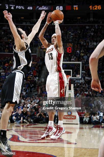 Delonte West of the Cleveland Cavaliers shoots a jump shot against Manu Ginobili of the San Antonio Spurs during the game at Quicken Loans Arena on...