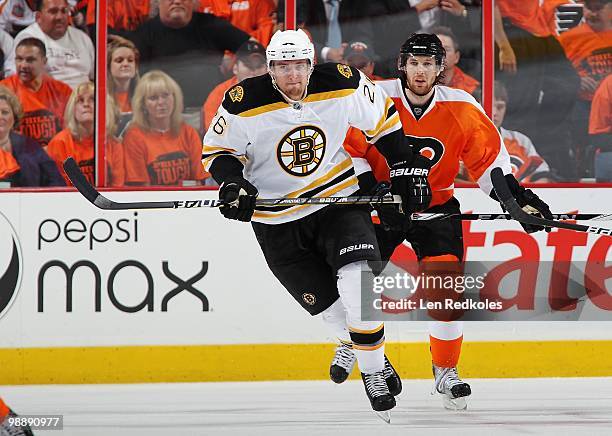 Blake Wheeler of the Boston Bruins skates against Braydon Coburn of the Philadelphia Flyers in Game Three of the Eastern Conference Semifinals during...