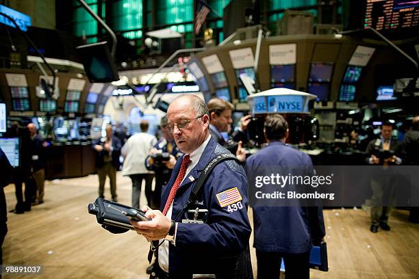 Traders work on the floor of the New York Stock Exchange in New York, U.S., on Thursday, May 6, 2010. The Dow Jones Industrial Average had its...