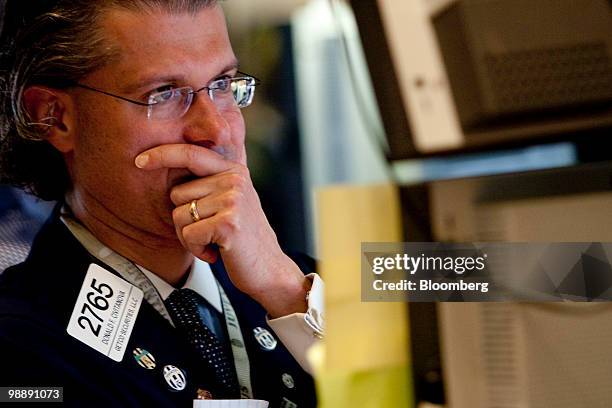 Donald Civitanova works at a post on the floor of the New York Stock Exchange in New York, U.S., on Thursday, May 6, 2010. The Dow Jones Industrial...