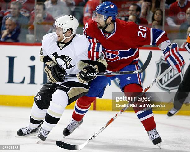 Ryan O'Byrne of the Montreal Canadiens defends against Matt Cooke of the Pittsburgh Penguins in Game Three of the Eastern Conference Semifinals...