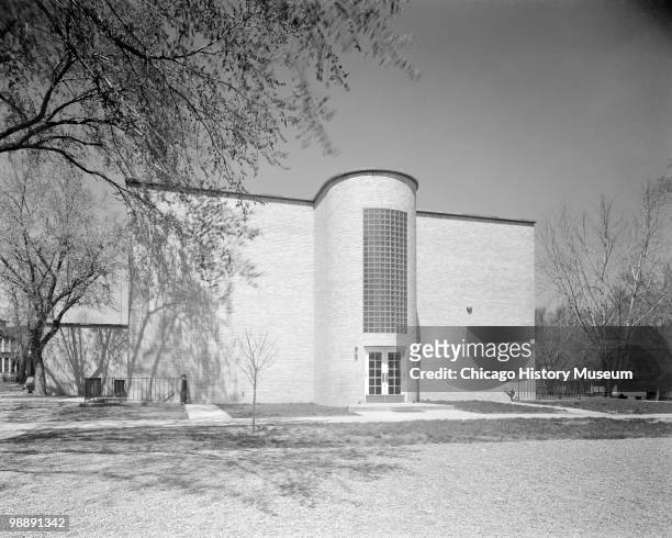 Exterior view showing the side of the Grimes School building, with an entrance and two story bay glass block above the doorway, June 1940. The school...