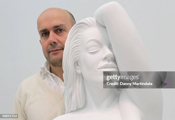 Marc Quinn poses in front of his sculpture 'Chelsea Charms' at photocall for Marc Quinn's new exhibition 'Allanah, Buck, Catman, Chelsea, Michael,...