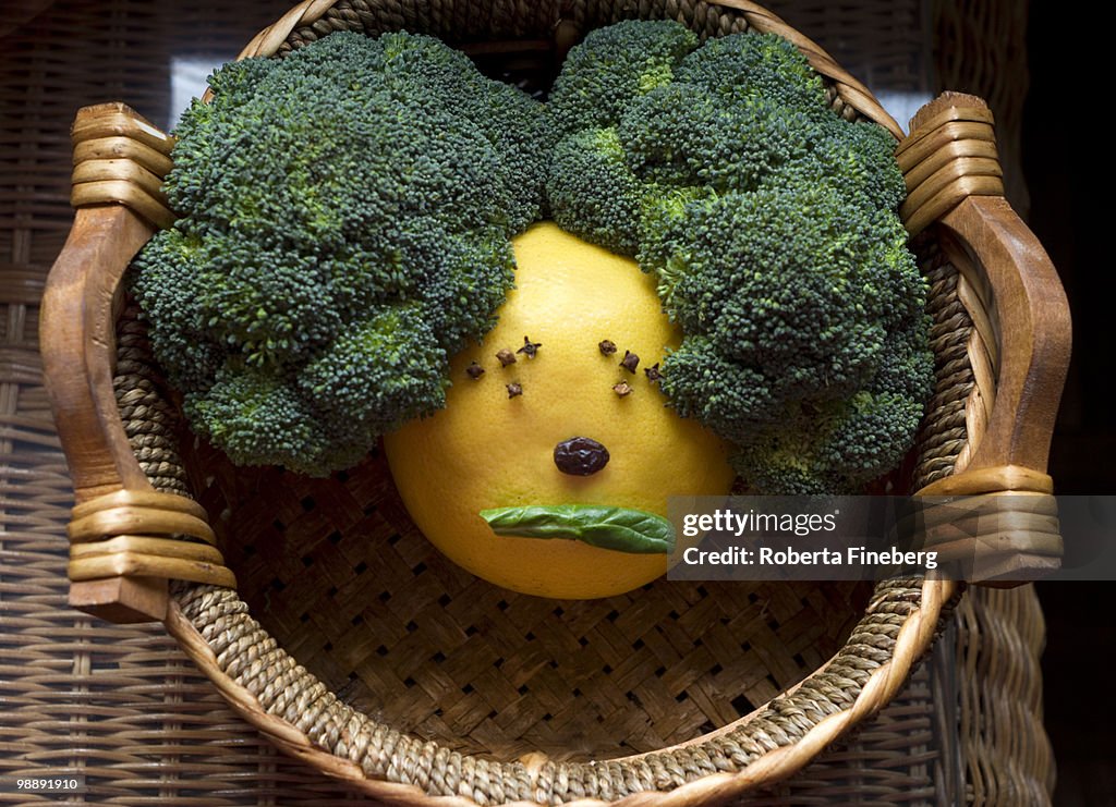 Funny face made from grapefruit and broccoli