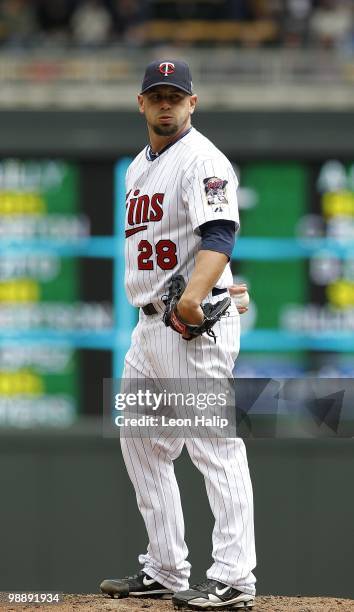 Jesse Crain of the Minnesota Twins pitches in the eighth inning during the game against the Detroit Tigers on May 5, 2010 at Target Field in...
