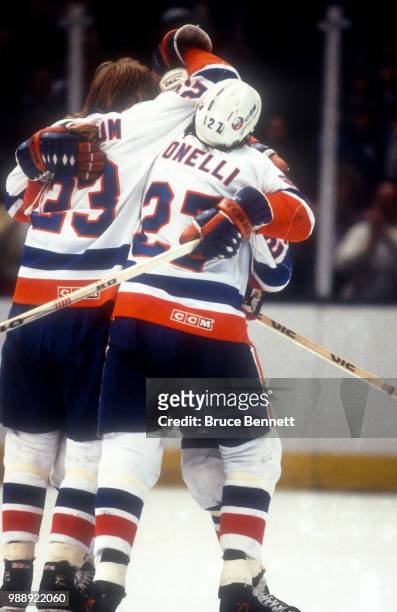 Bob Nystrom and John Tonelli of the New York Islanders celebrate a goal with their teammate druring the 1983 Stanley Cup Finals against the Edmonton...