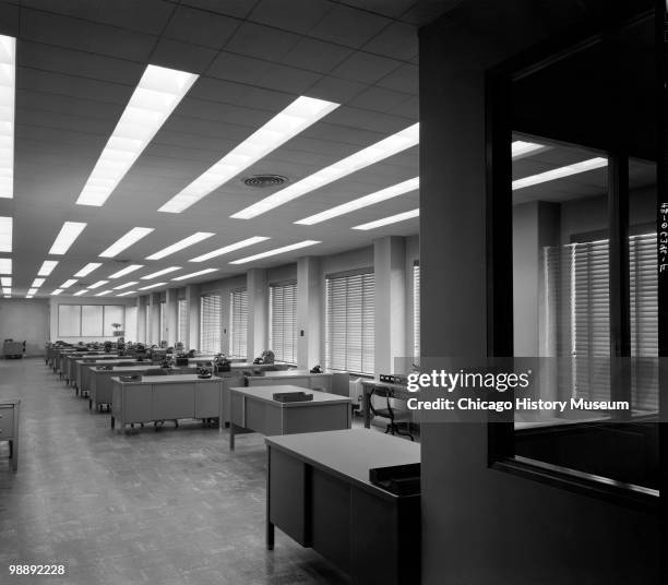 Interior view of the General Electric office building at 840 South Canal Street in Chicago, IL, June 1941. View shows a room full of desks with...