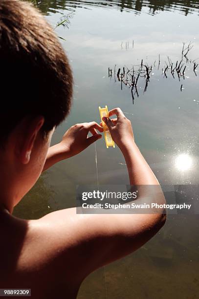 boy fishing - newhealth foto e immagini stock