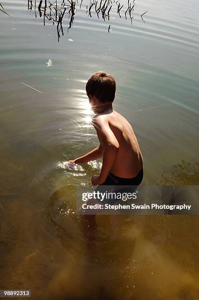 boy fishing - newhealth stock pictures, royalty-free photos & images