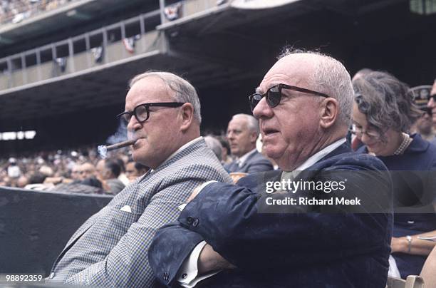 All Star Game: American League president Joe Cronin with National League president Warren Giles sitting in stands during game at RFK Memorial...