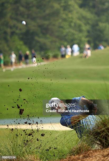 Hunter Mahan plays a shot from the rough on the 12th hole during the first round of THE PLAYERS Championship held at THE PLAYERS Stadium course at...