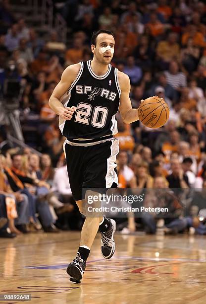 Manu Ginobili of the San Antonio Spurs handles the ball during Game Two of the Western Conference Semifinals of the 2010 NBA Playoffs against the...