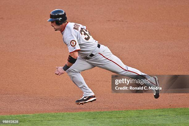 Aaron Rowand of the San Francisco Giants tries to steal second base during a MLB game against the Florida Marlins in Sun Life Stadium on May 4, 2010...