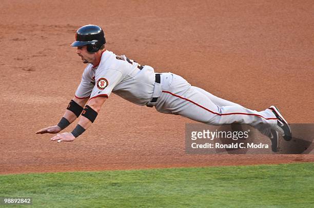 Aaron Rowand of the San Francisco Giants tries to steal second base during a MLB game against the Florida Marlins in Sun Life Stadium on May 4, 2010...
