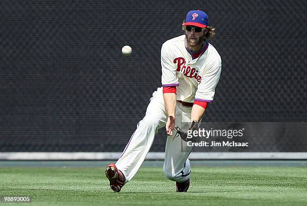 Jayson Werth of the Philadelphia Phillies attempts to make a catch against the St. Louis Cardinals at Citizens Bank Park on May 6, 2010 in...