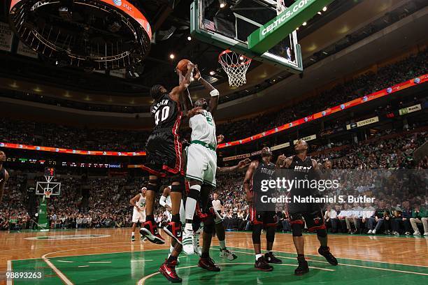 Kevin Garnett of the Boston Celtics shoots against Udonis Haslem of the Miami Heat in Game Five of the Eastern Conference Quarterfinals during the...