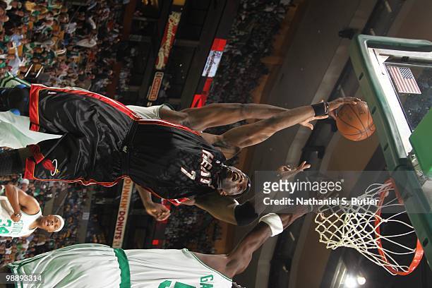 Jermaine O'Neal of the Miami Heat goes up for a basket against the Boston Celtics in Game Five of the Eastern Conference Quarterfinals during the...