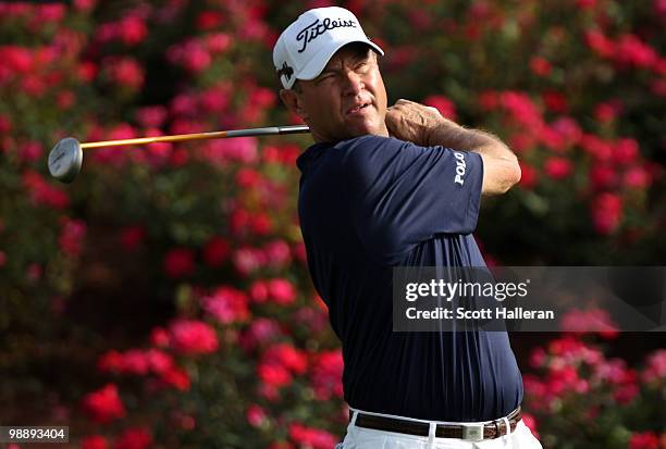 Davis Love III plays his tee shot on the 18th hole during the first round of THE PLAYERS Championship held at THE PLAYERS Stadium course at TPC...