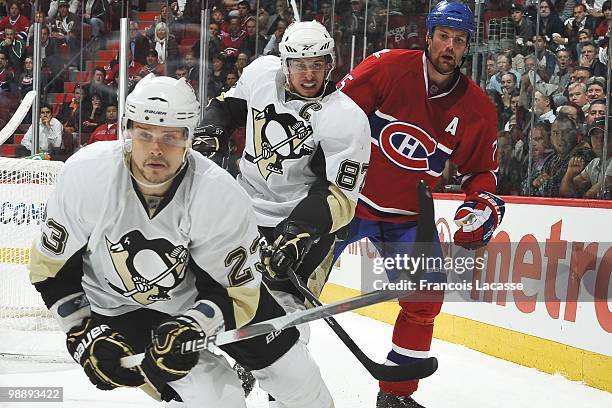 Hal Gill of Montreal Canadiens battles for the puck with Sidney Crosby of the Pittsburgh Penguins in Game Three of the Eastern Conference Semifinals...