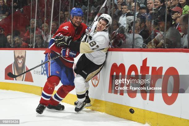 Hal Gill of Montreal Canadiens collides with Sidney Crosby of the Pittsburgh Penguins in Game Three of the Eastern Conference Semifinals during the...