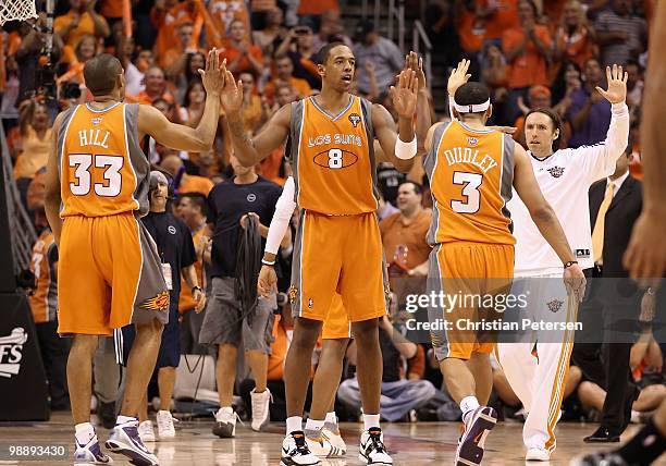 Channing Frye of the Phoenix Suns high-fives teammates Jared Dudley and Grant Hill after scoring against the San Antonio Spurs during Game Two of the...