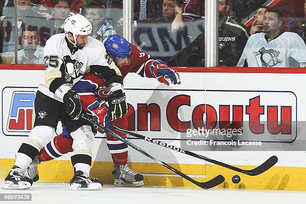 Maxime Talbot of the Pittsburgh Penguins battles for the puck with Tom Pyatt of Montreal Canadiens in Game Three of the Eastern Conference Semifinals...