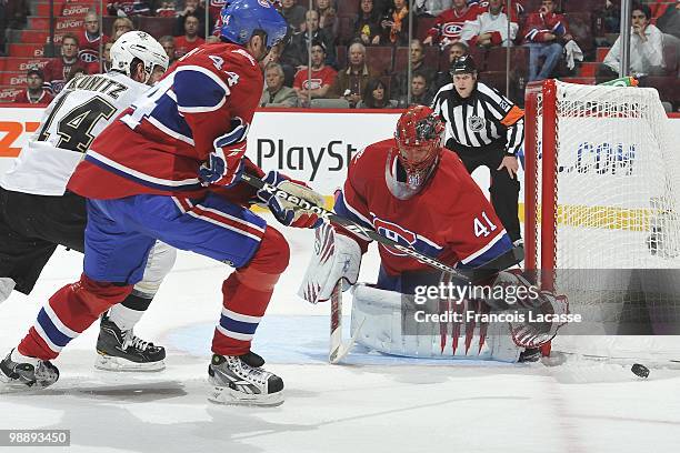 Chris Kunitz of the Pittsburgh Penguins takes a shot on goalie Jaroslav Halak of Montreal Canadiens in Game Three of the Eastern Conference...