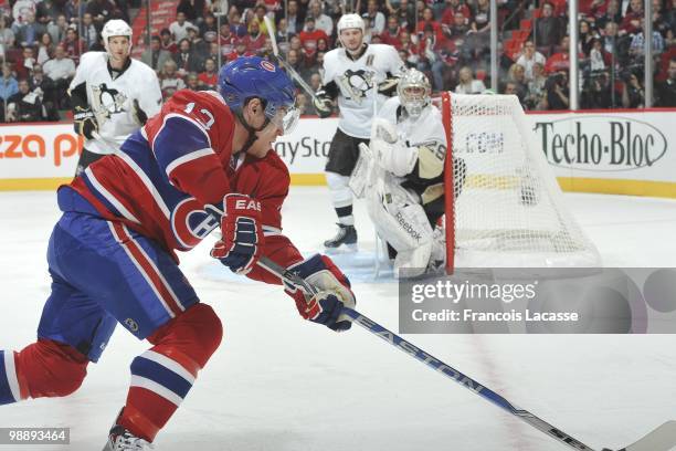 Mike Cammalleri of Montreal Canadiens takes a shot on goalie Marc-Andre Fleury of the Pittsburgh Penguins in Game Three of the Eastern Conference...