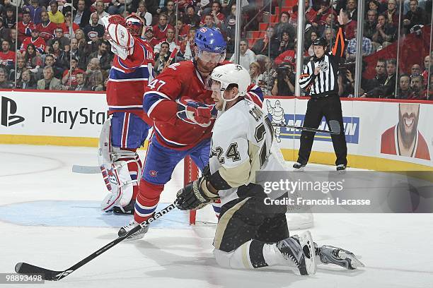 Marc-Andre Bergeron of Montreal Canadiens pushes Matt Cooke of the Pittsburgh Penguins in Game Three of the Eastern Conference Semifinals during the...