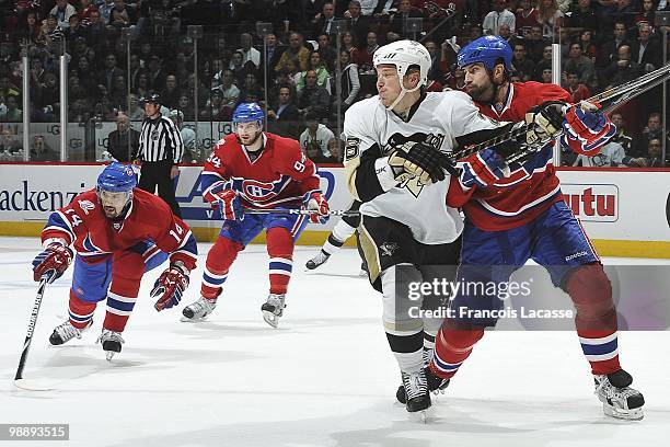 Roman Hamrlik of Montreal Canadiens battles for the puck with Ruslan Fedotenko of the Pittsburgh Penguins in Game Three of the Eastern Conference...