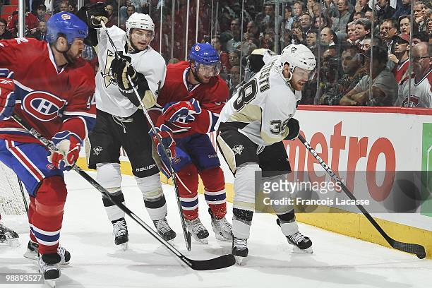 Mark Letestu of the Pittsburgh Penguins skates with the puck in front of Tom Pyatt of Montreal Canadiens in Game Three of the Eastern Conference...