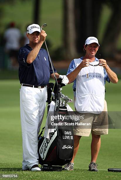 Davis Love III pulls a club on the 15th hole during the first round of THE PLAYERS Championship held at THE PLAYERS Stadium course at TPC Sawgrass on...