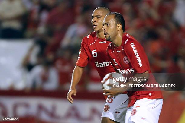 Footballer Alecsandro , of the Brazilian team Internacional, celebrates with Walter, after scoring against Argentina's Banfield in a Libertadores Cup...